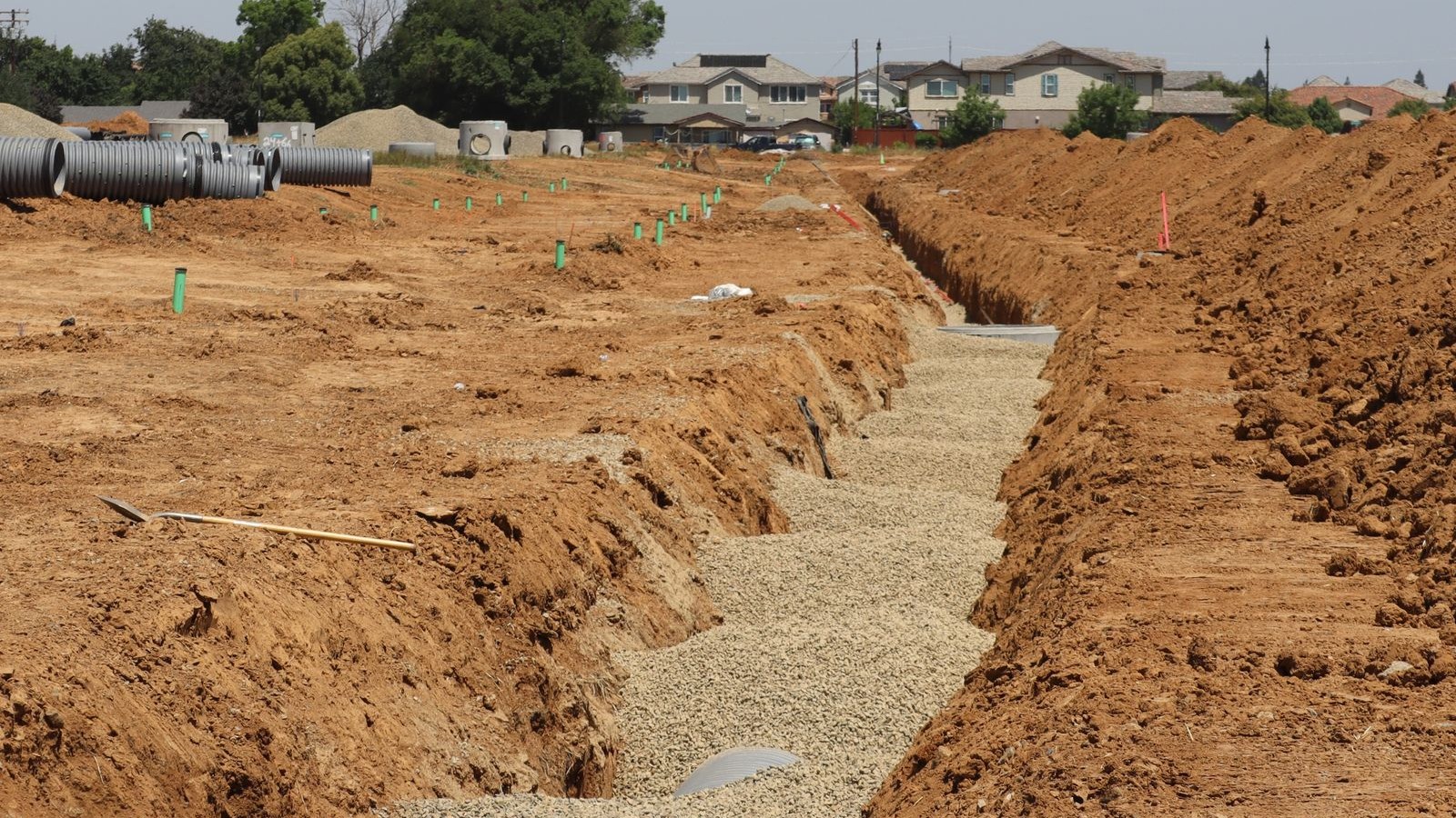 Subdivision in progress with services trench and pipes