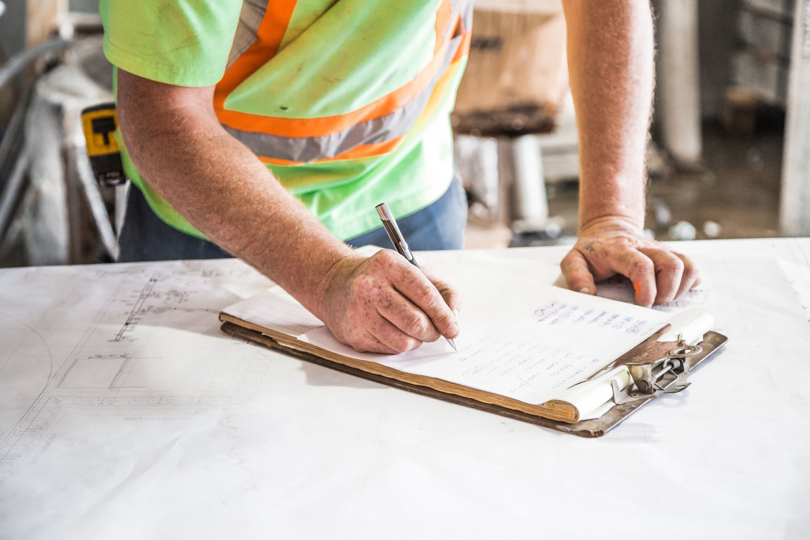 Property professionals reviewing plans around a table
