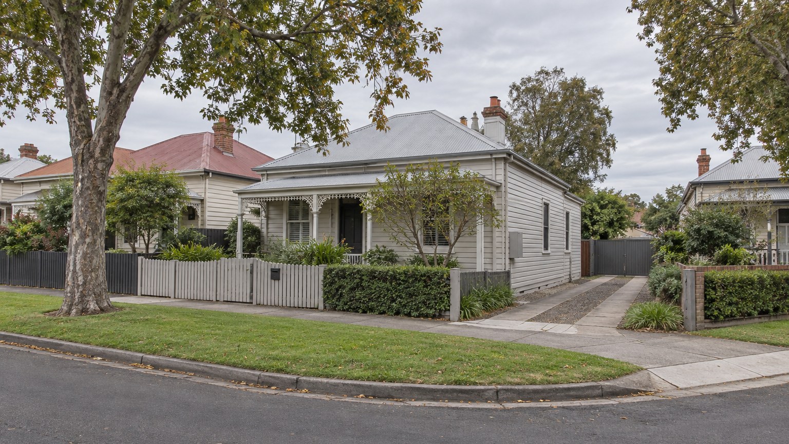 Illustrative view of a modest weatherboard house on a corner block in an established Australian suburban street with a side driveway